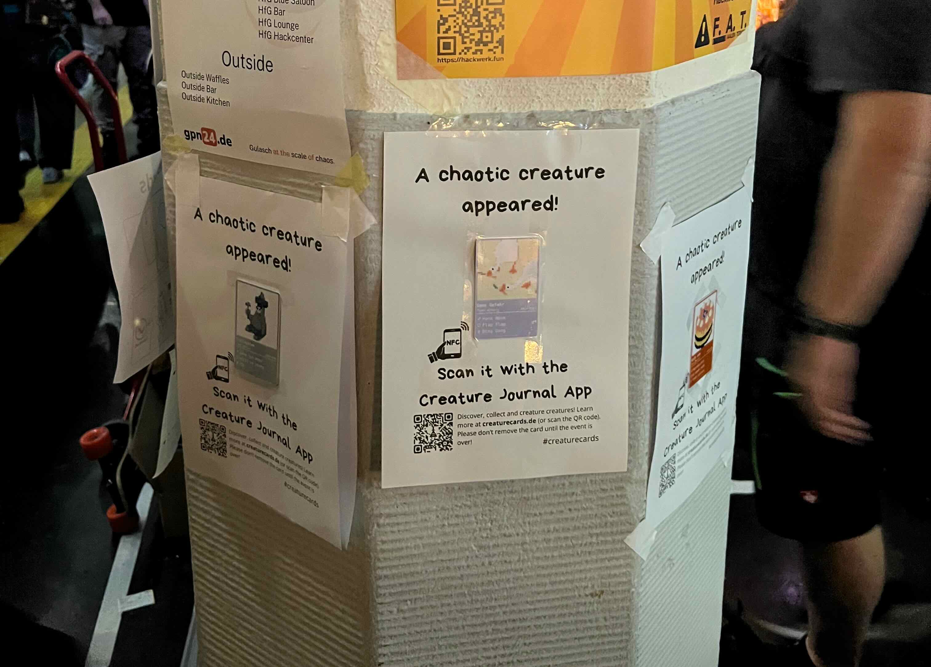 Pillar with 3 creature cards on an A4 poster each